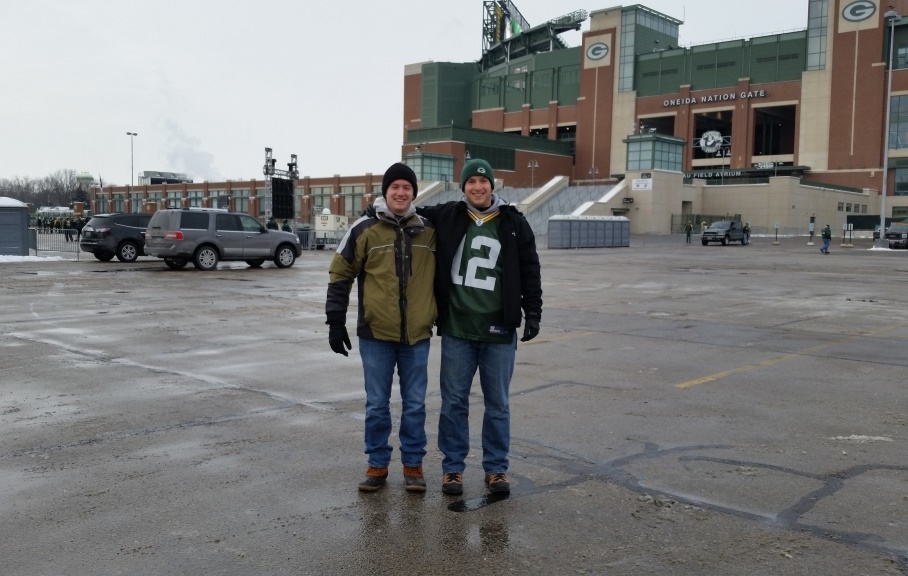 Stephen Bonney 2 men at football game parking lot