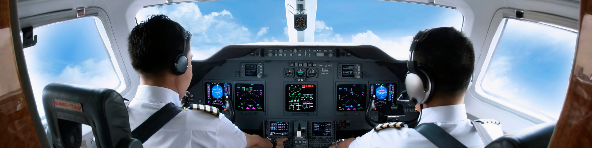 image of two pilots in a plane