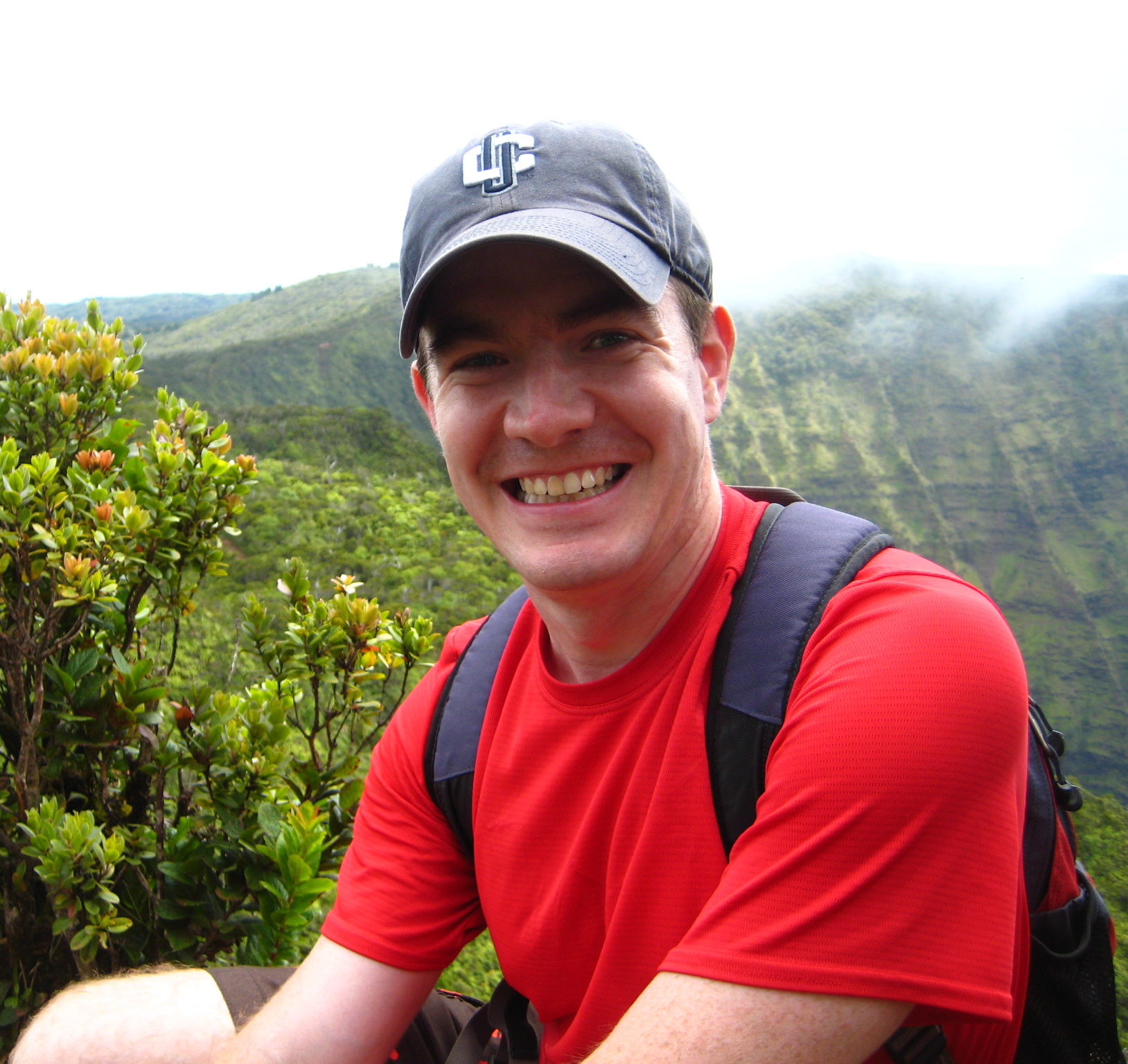 man climbing mountain
