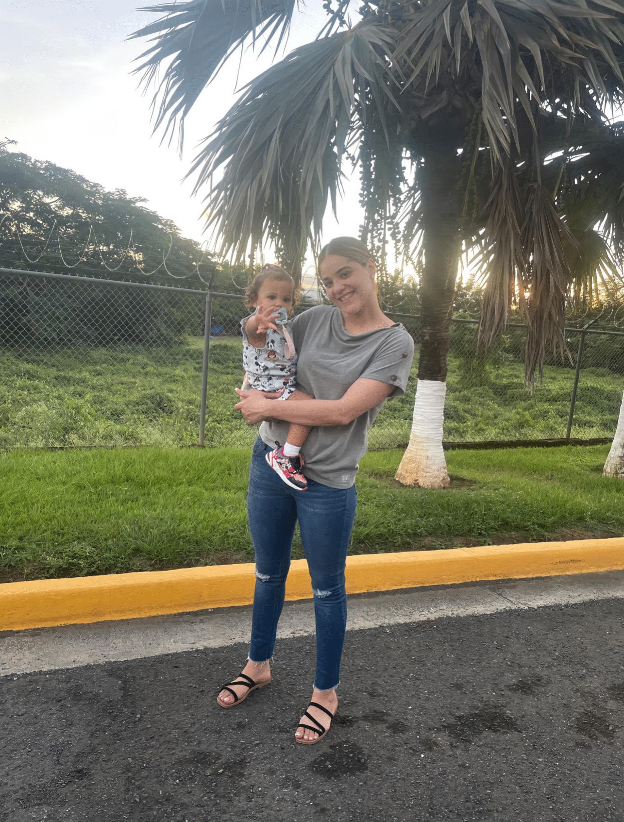 Melanie young mom and young daughter by palm trees