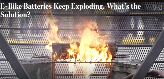 Image shows text "E-Bike Batteries Keep Exploding. What's the Solution?" along with image of a fire.