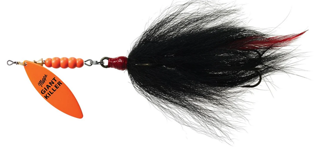 Image shows a Mepp’s Giant Killler tandem bucktail with an orange blade and black tail.