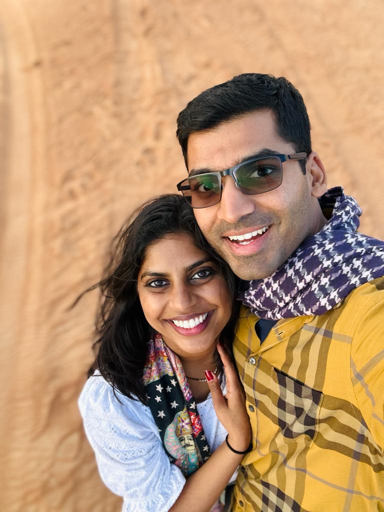 man and women on nature trail smiling for picture