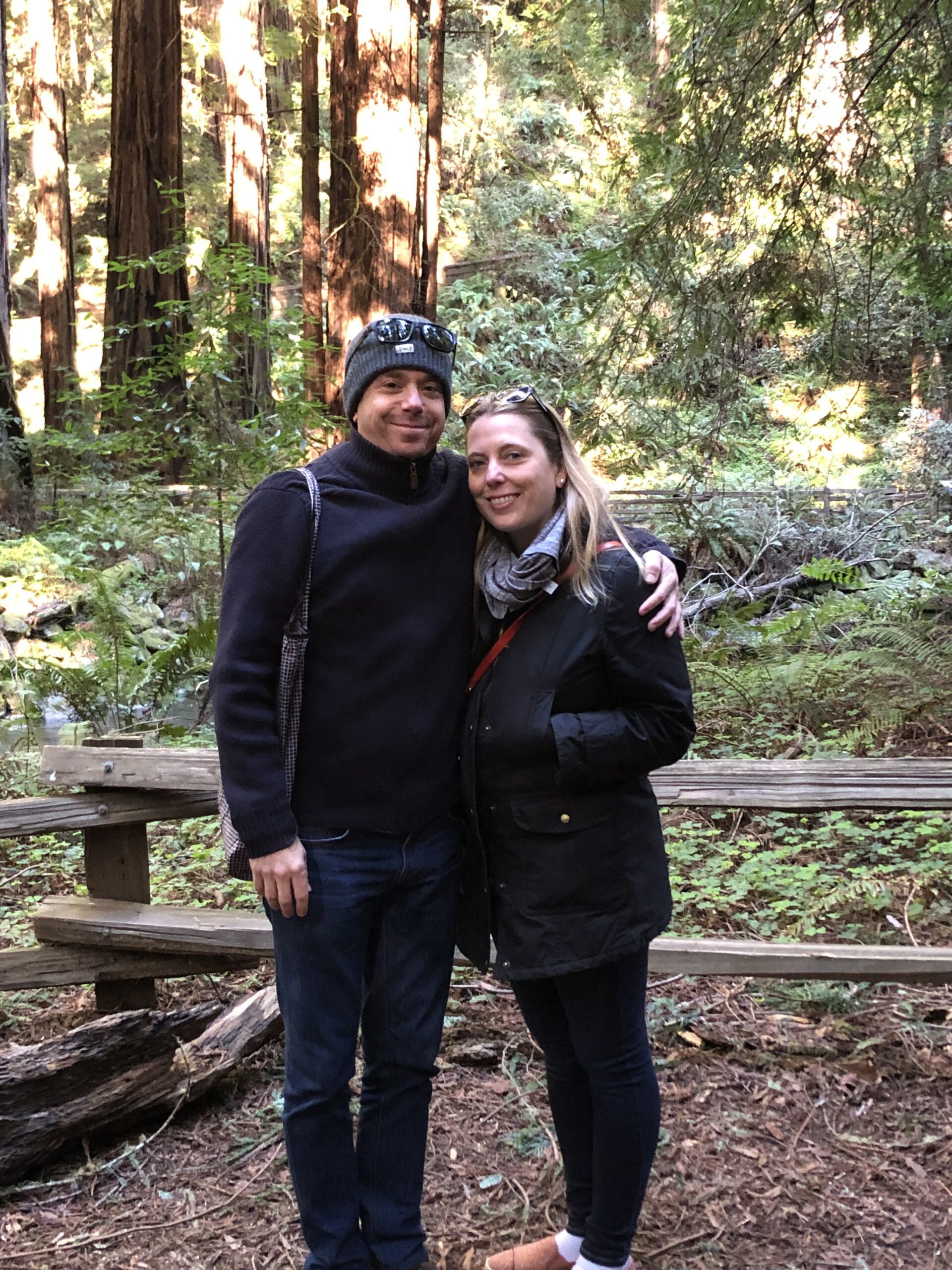 man and women on nature trail smiling for picture