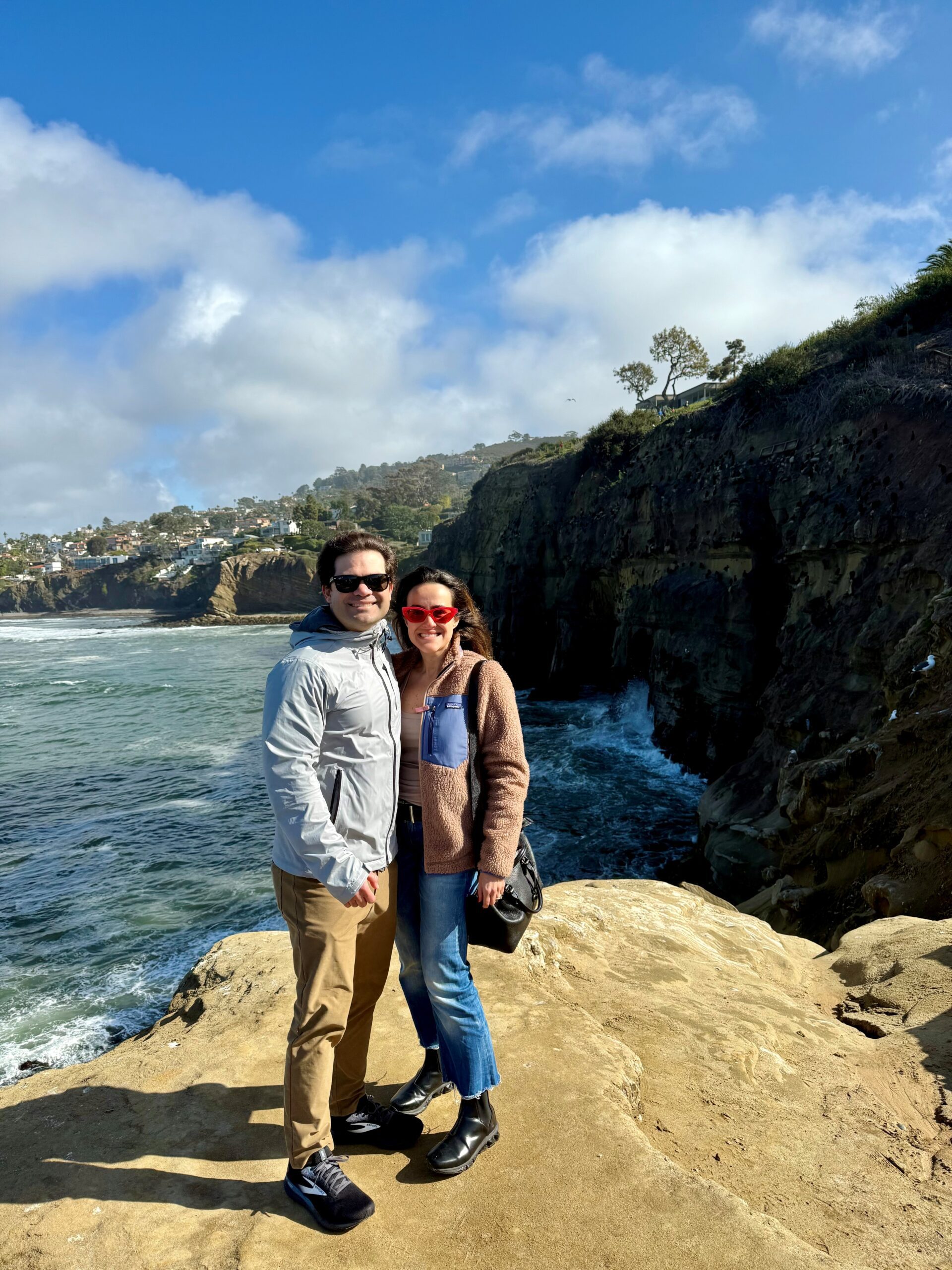 man and women in nature smiling for picture