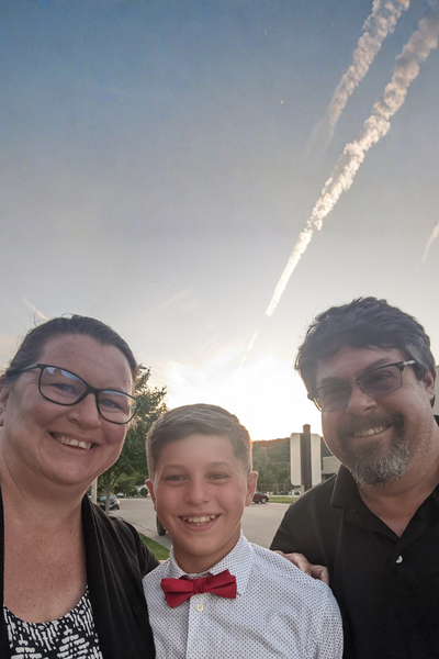 Image shows Mike D. and his family.