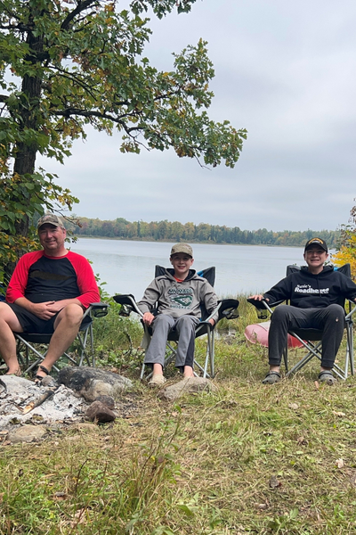 Image shows Jon Packer and his sons.